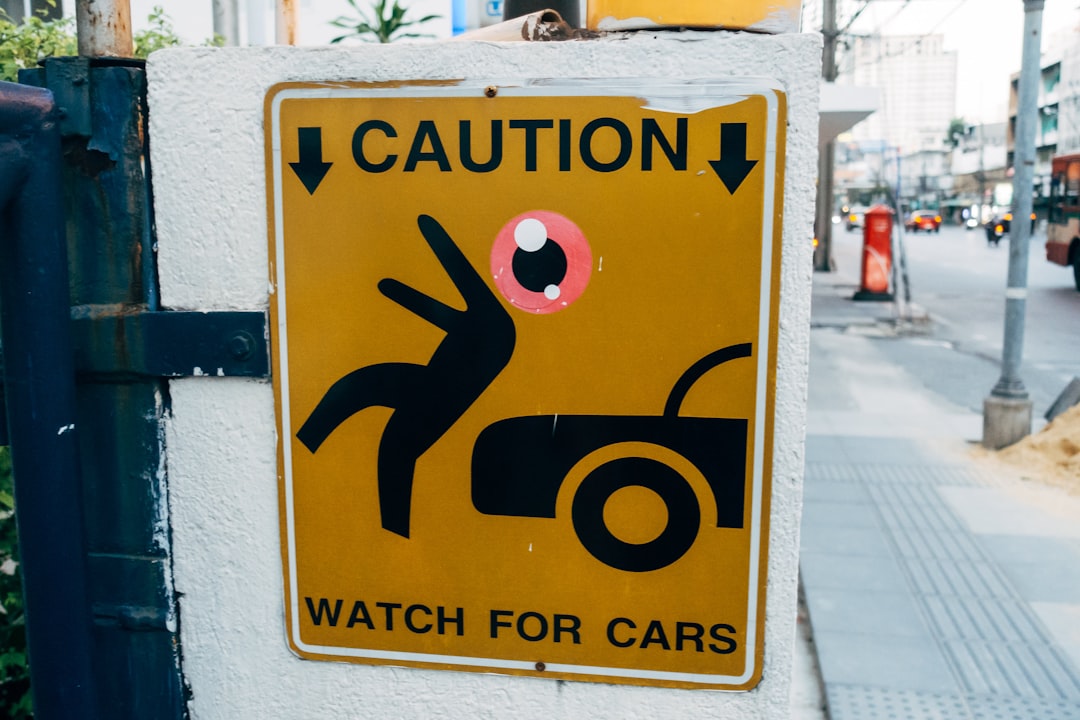 a-caution-sign-on-the-side-of-a-building-iuepzklxx-e