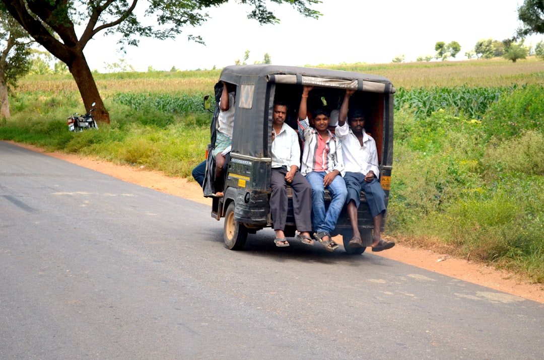 men-riding-auto-rickshaw-n4omt7cdqjc